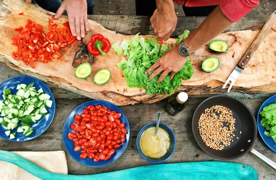 Chopped vegetables spread out on an outdoor table