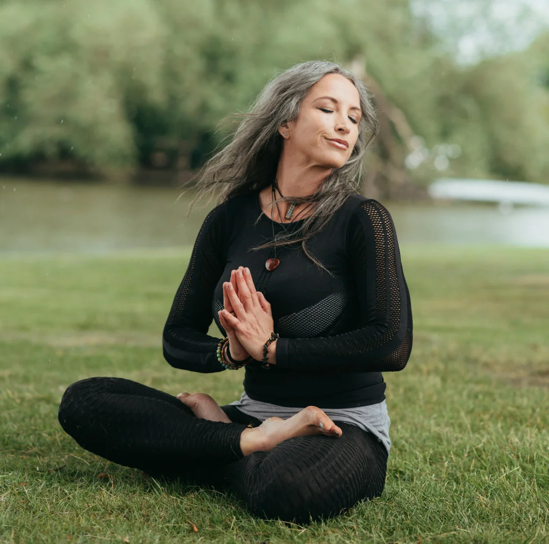 Woman meditating outdoors