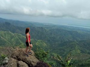 woman on top of mountain - summer health