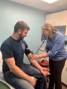 man getting blood pressure checked at Vitality Family Health