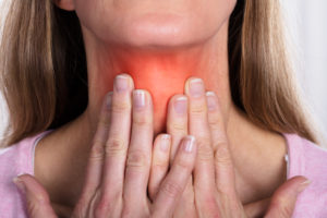 Close-up Of Mature Female Suffering From Gland Inflammation - Hypothyroidism